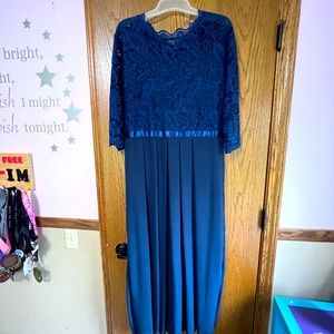 3/4 length sleeves long dress. Lacy top. Zip up back. Never worn.